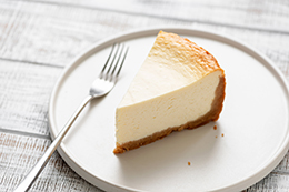 Slice Of Plain Cheesecake On White Plate
